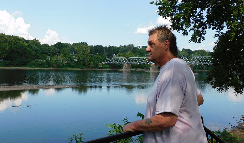 Tommy looking over Delaware river